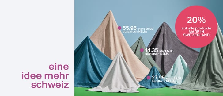 Mehrere Handtücher in verschiedenen Farben, aufgestellt wie Berge. Rabatt von 20 % auf Produkte „Made in Switzerland“.